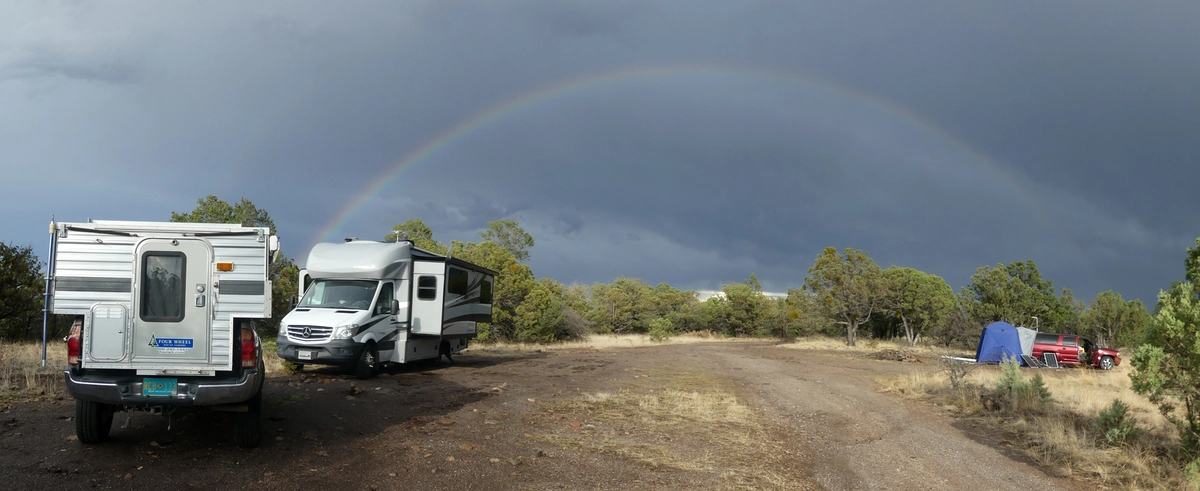 campiing rigs with a rainbow