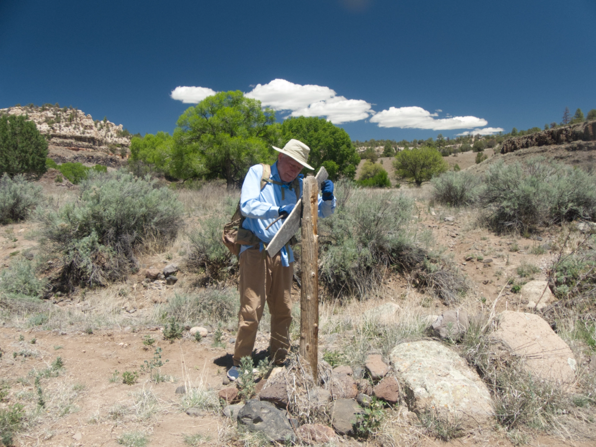 Dennis repairing the trail sign
