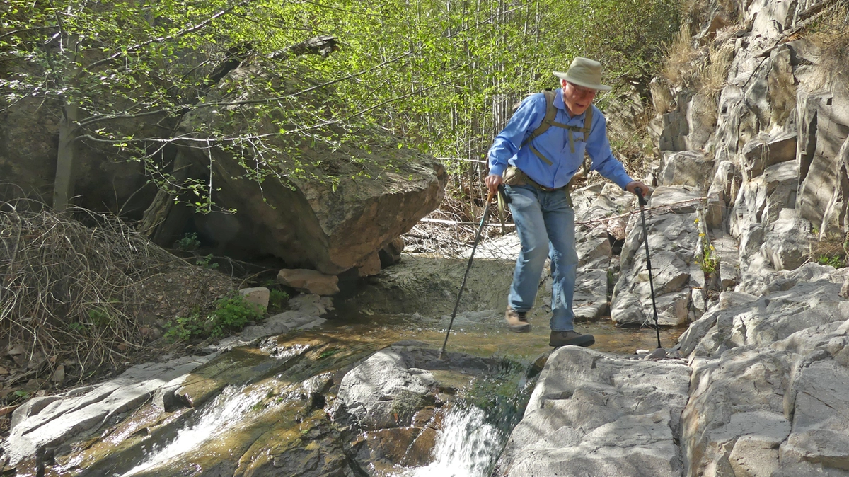 Dennis crossing the creek