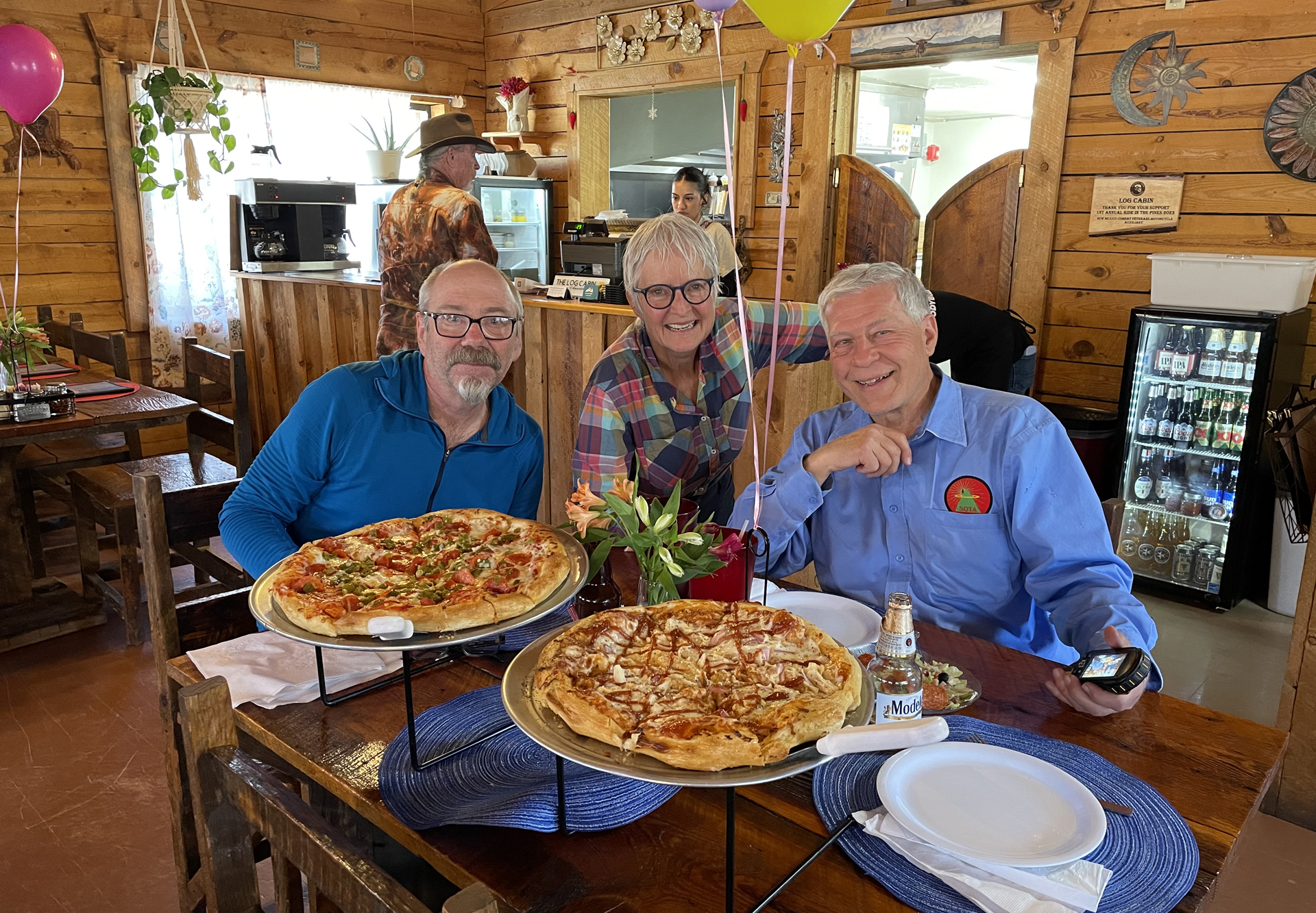 Ken, Dennis and me with pizzas at the Log Cabin