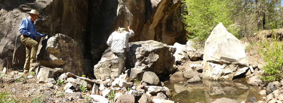 Dennis and Ken by a pool in a rocky canyon