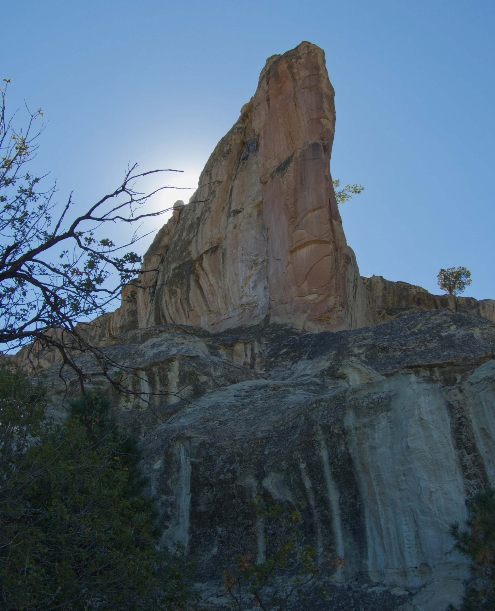 sunlight behind a pinnacle on Inscription Rock Trail