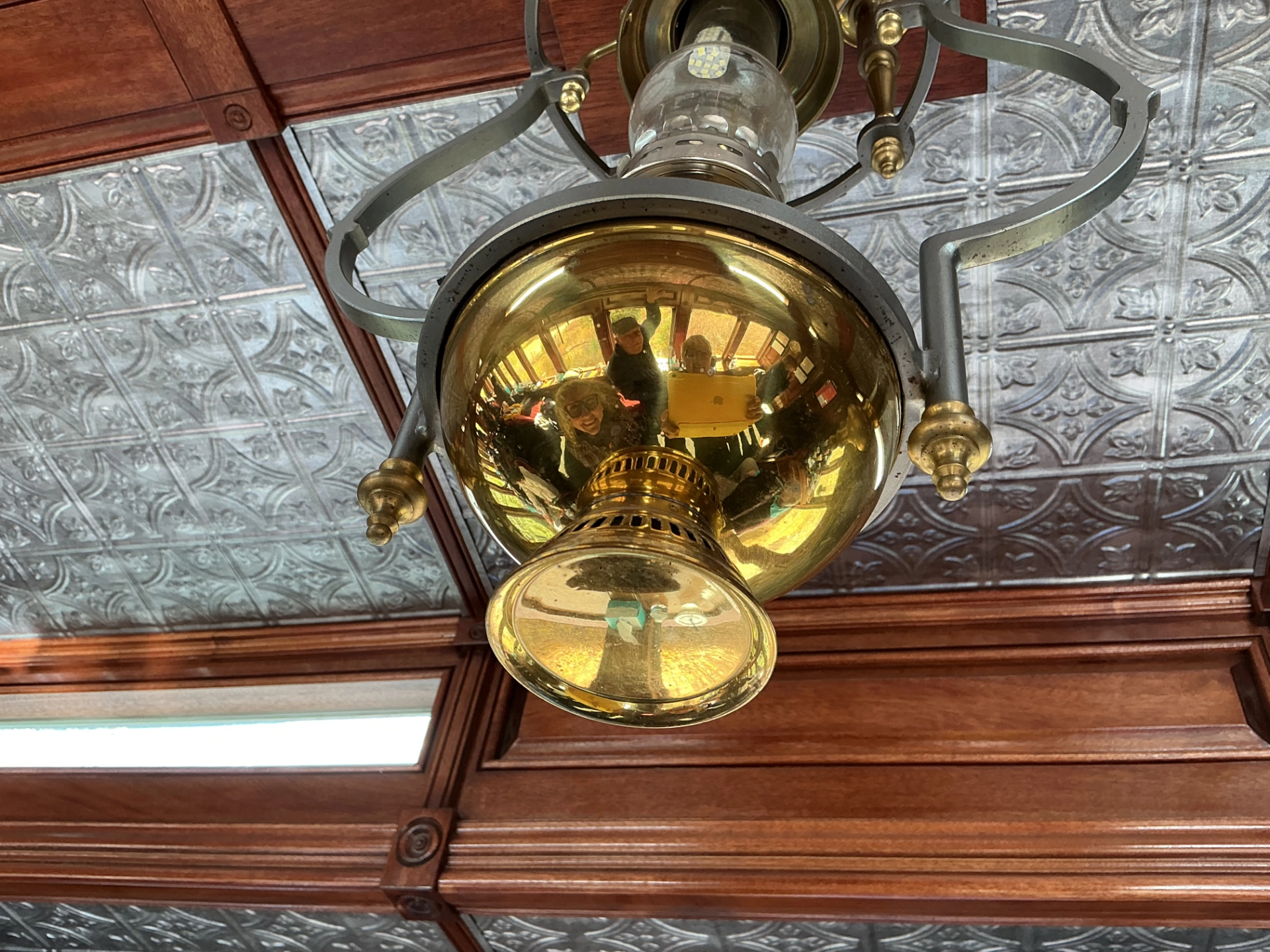 reflections in a reproduction gas lantern