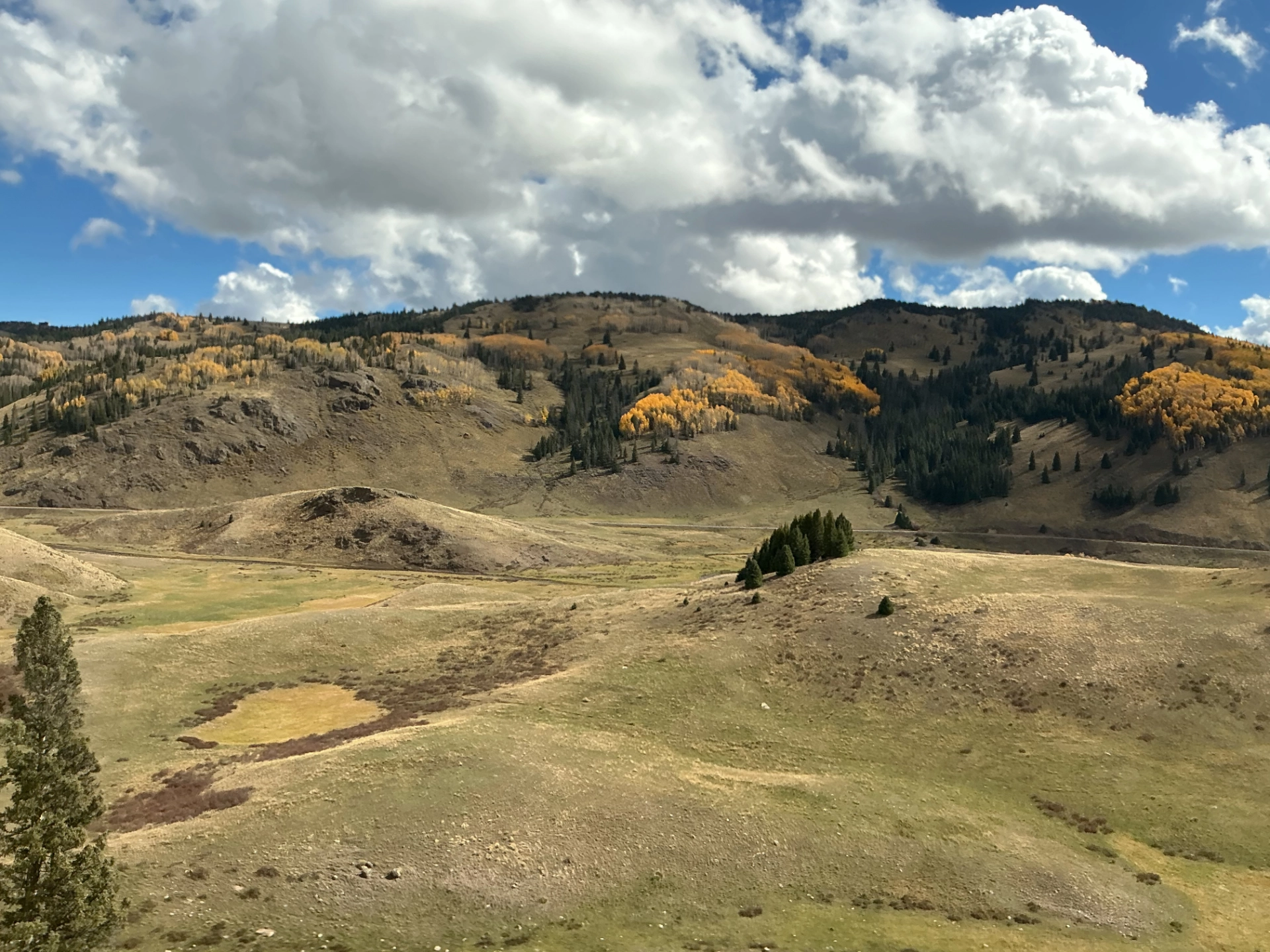 rolling plains and partly cloudy skies