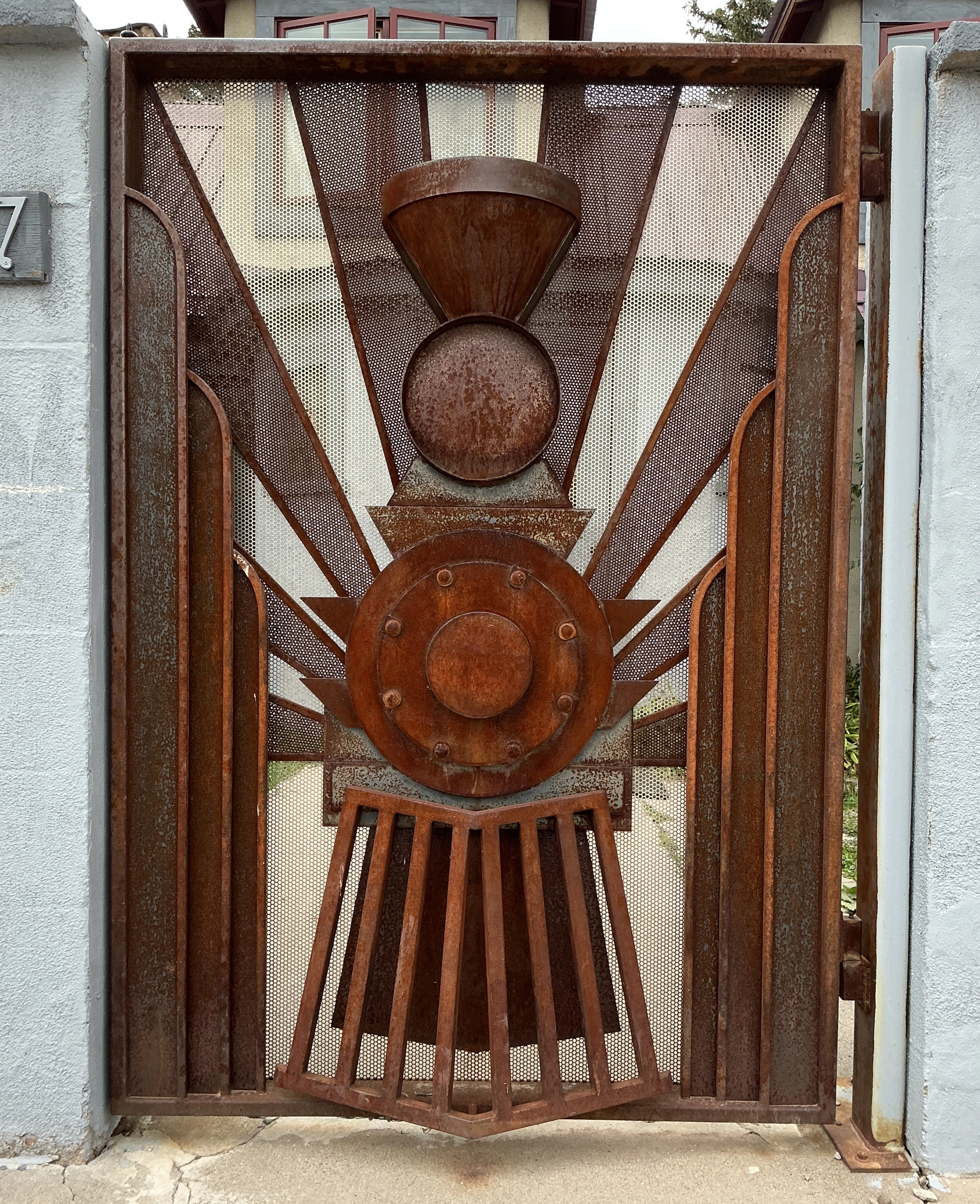 train-themed metal gate in Chama