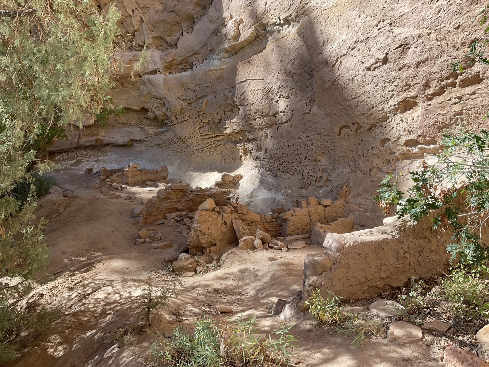 crumbled foundations at the base of the cliff