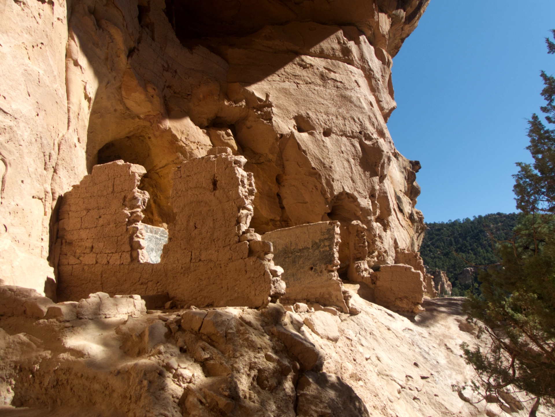 crumbling adobe structure with a mysterious spiral