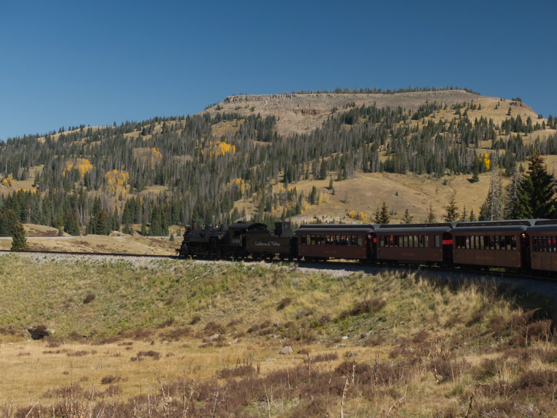 view of the train crossing an open plain