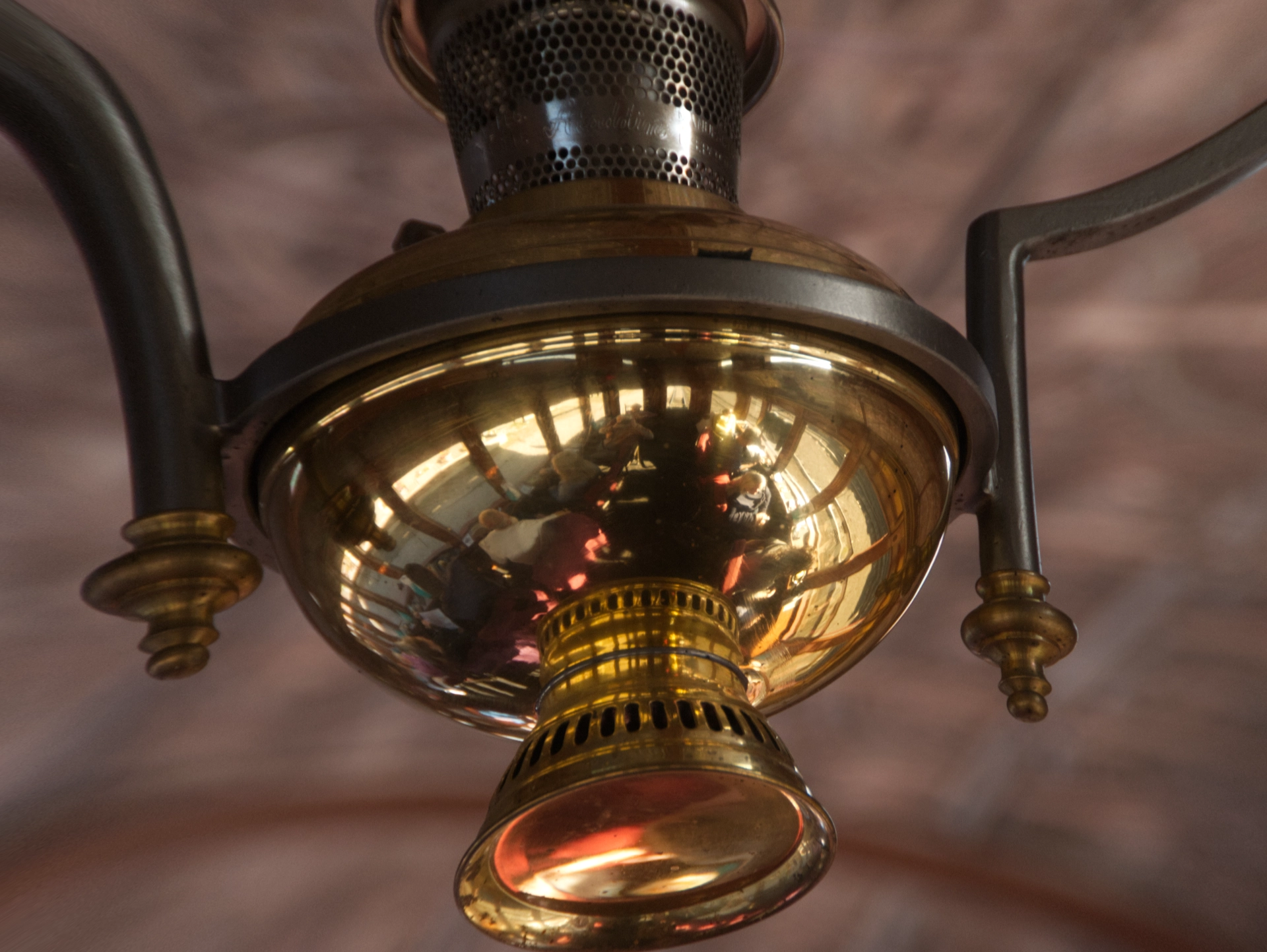 reflections in the brass ceiling fixture