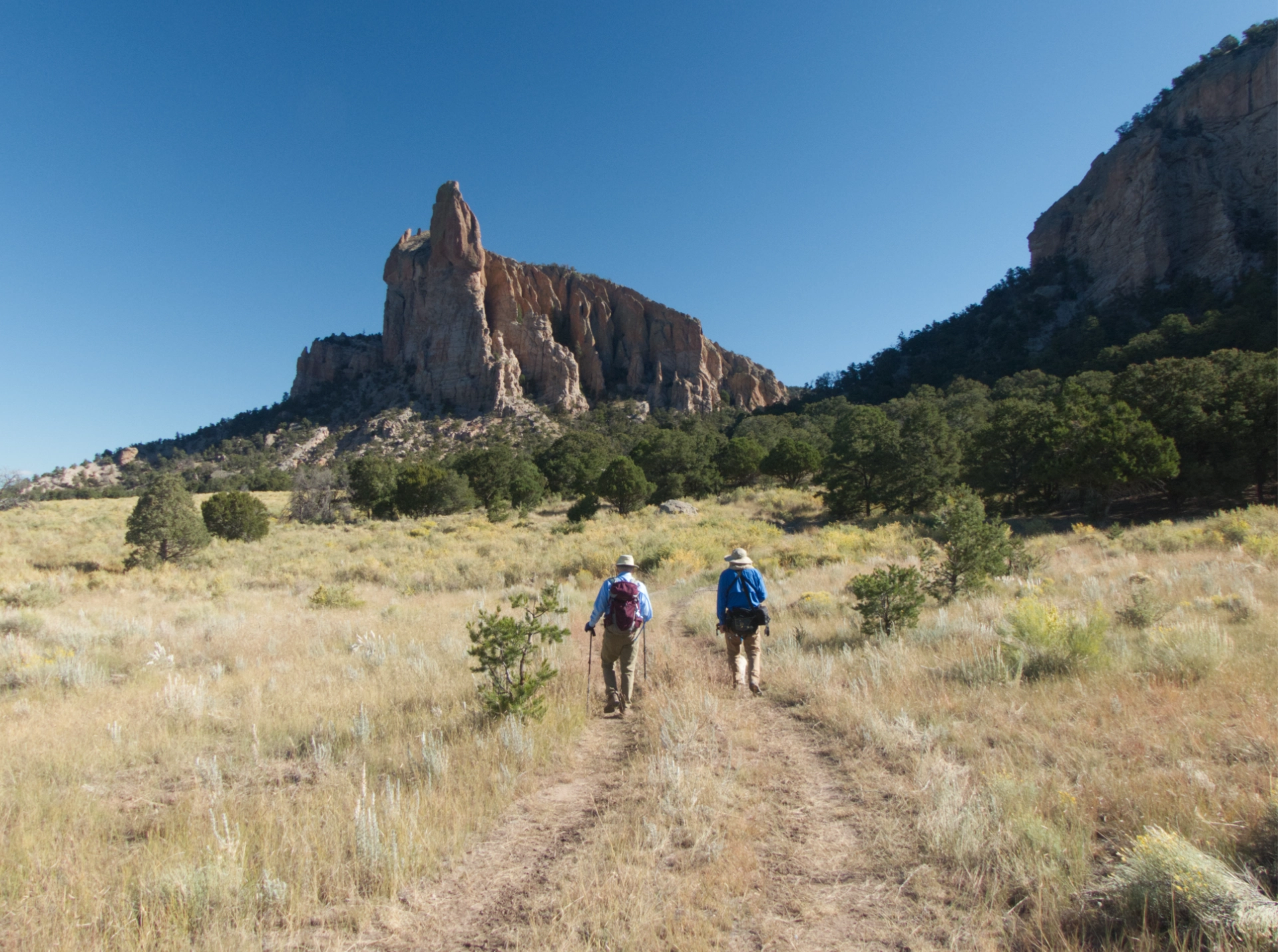 walking toward a many-spired peak in the morning light