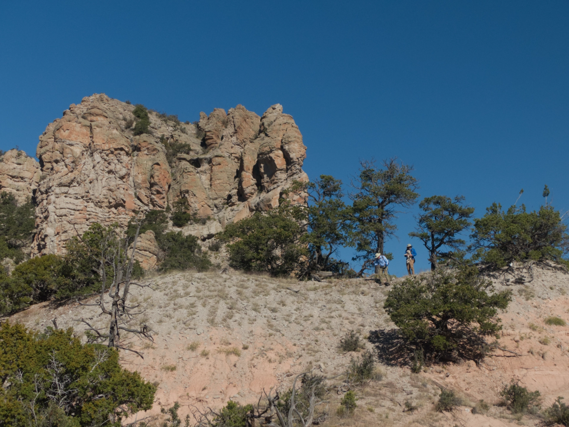 hikers on a ridge below peak 8945