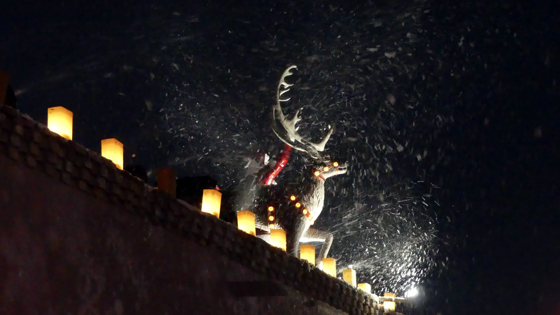 fake snow flying from roof of building