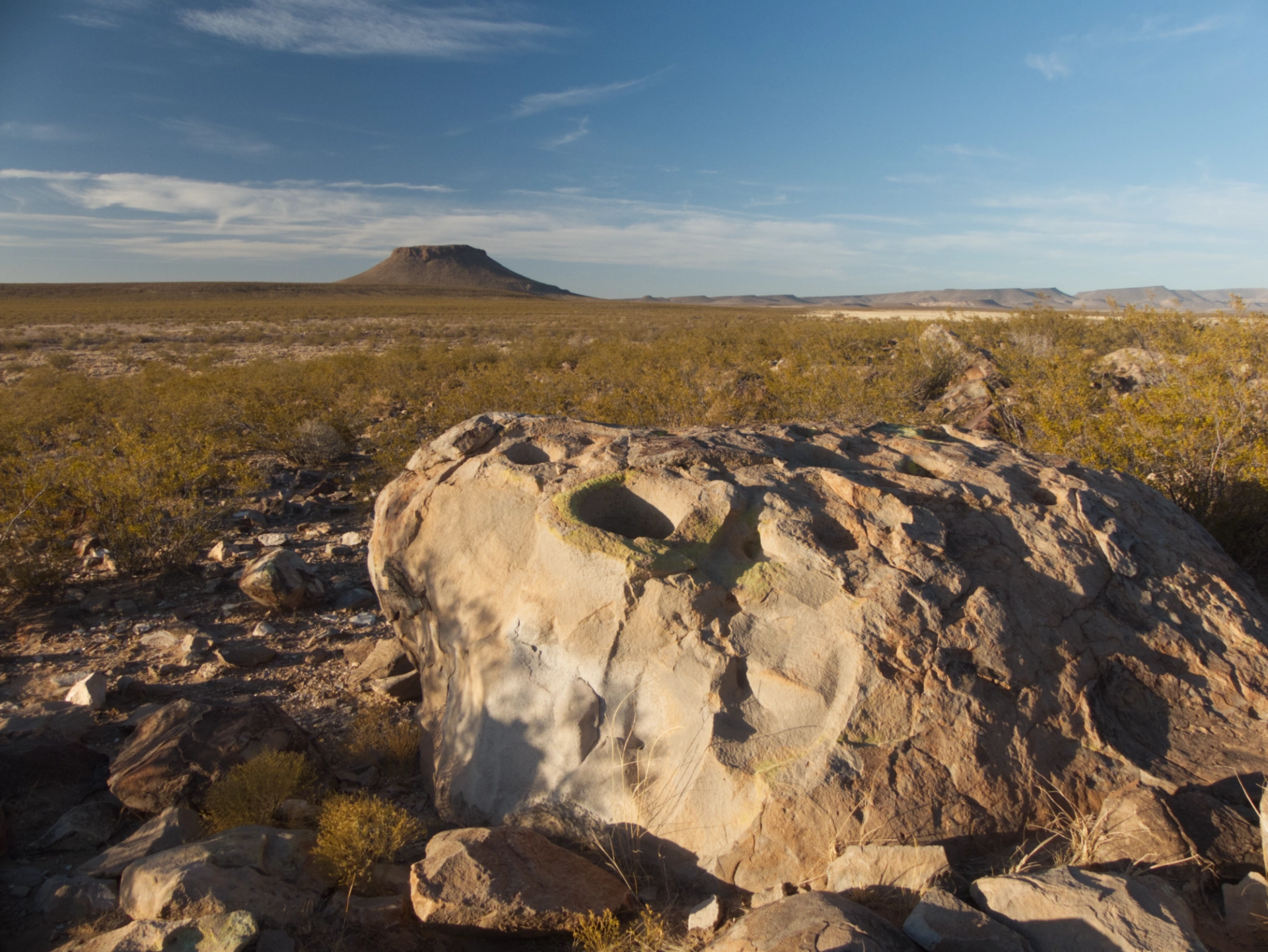 bedrock mortars with Massacre Peak at sunset