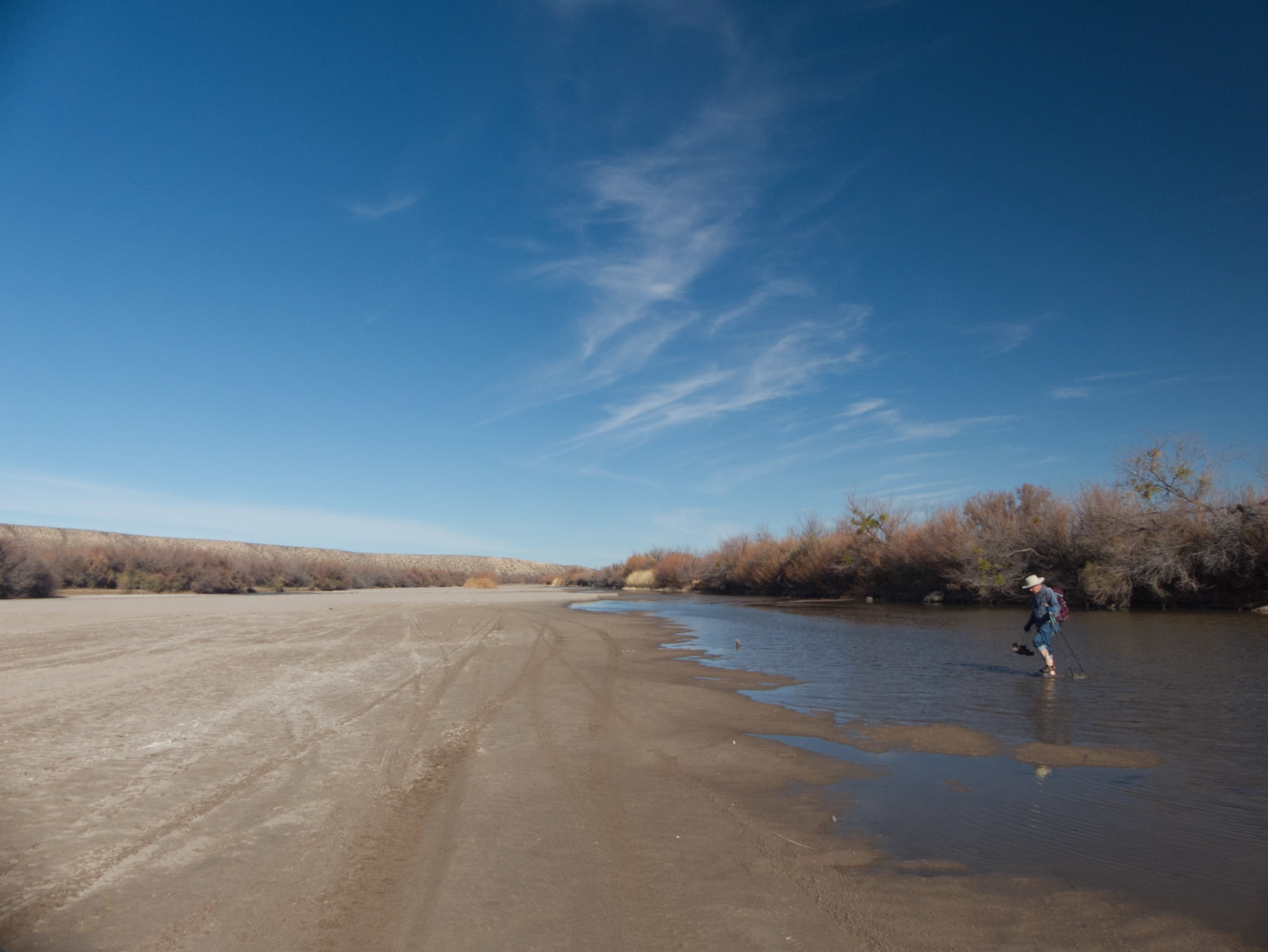 wading across the nearly dry Rio Grande