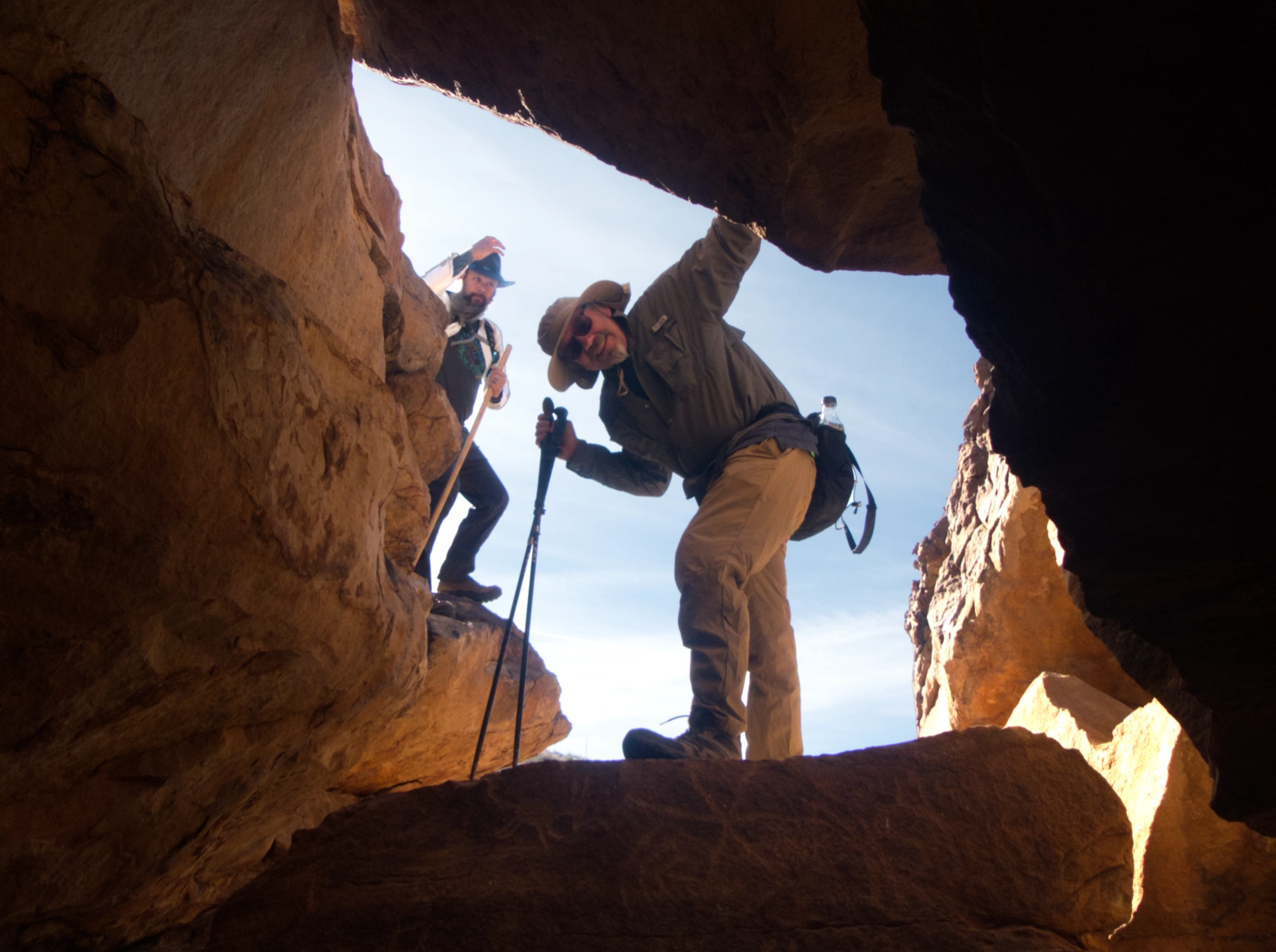 Ken and Chris peering into a rock shelter