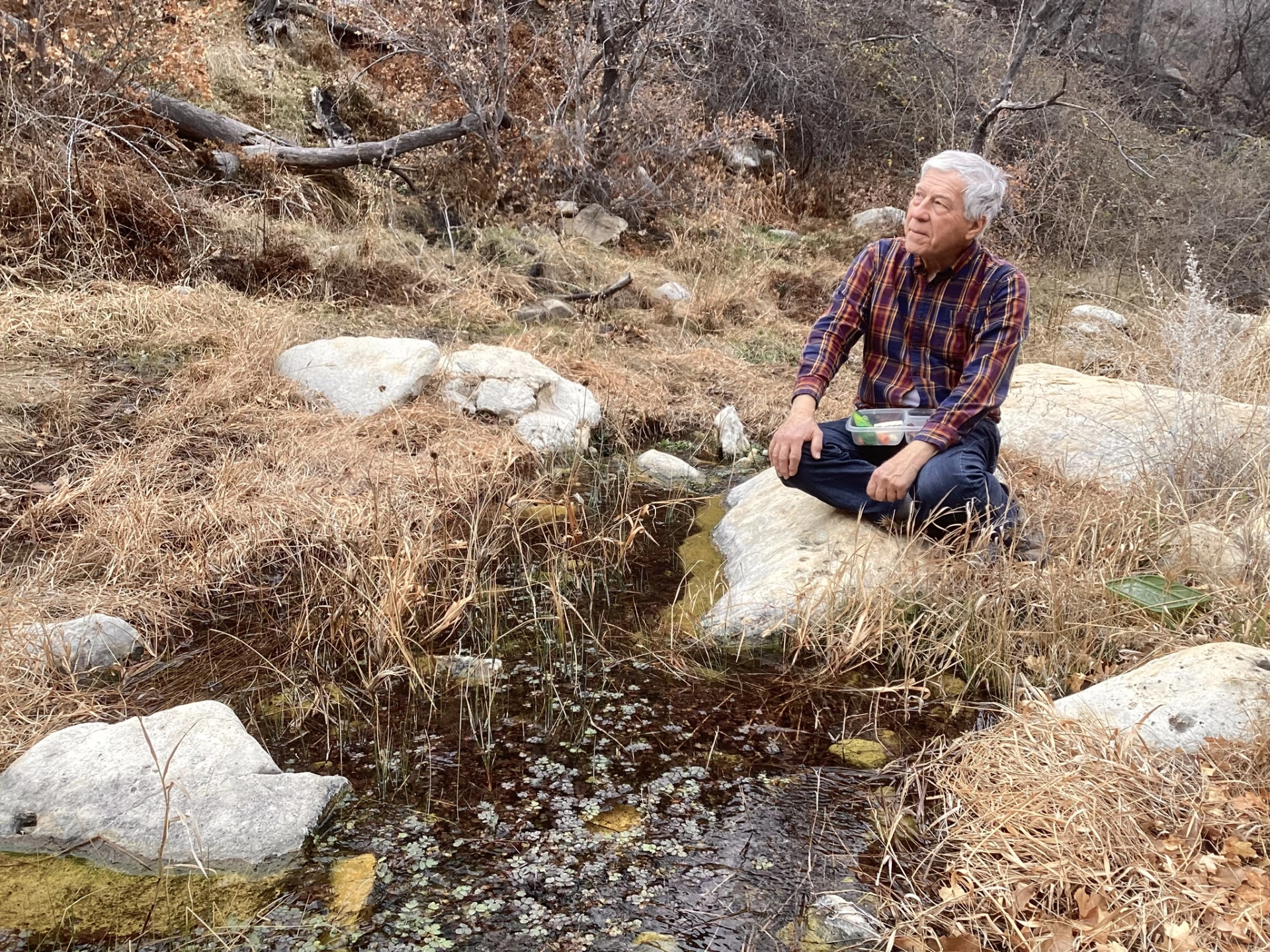 eating lucnh by a pool in Sitting Bull Canyon