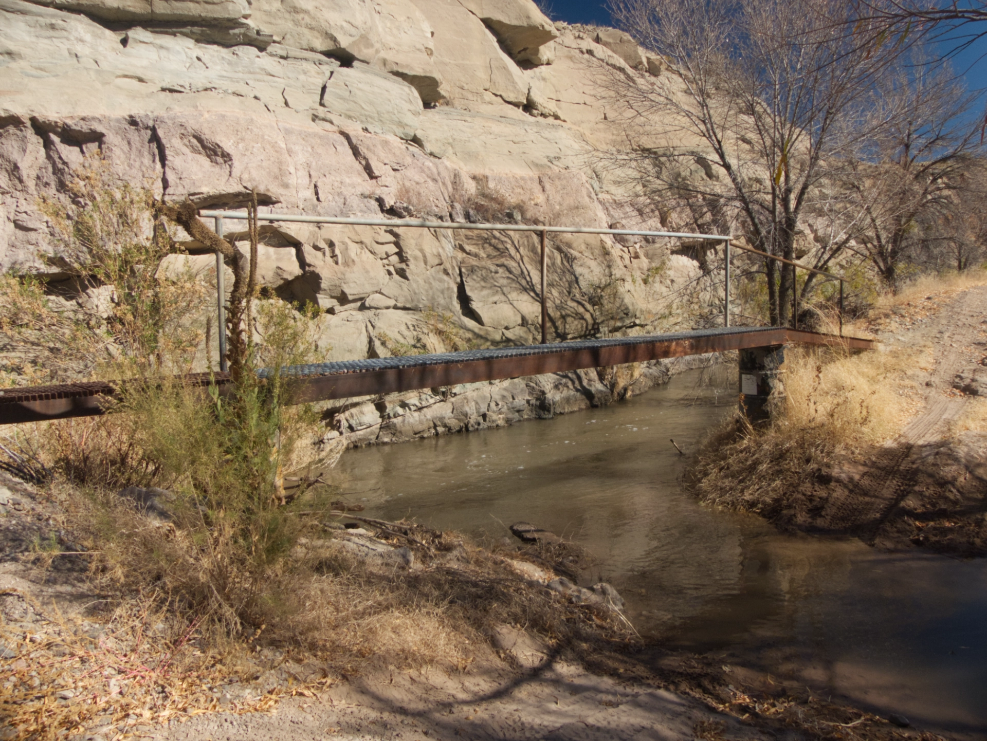 old metal pedestrian bridge over the aqueduct