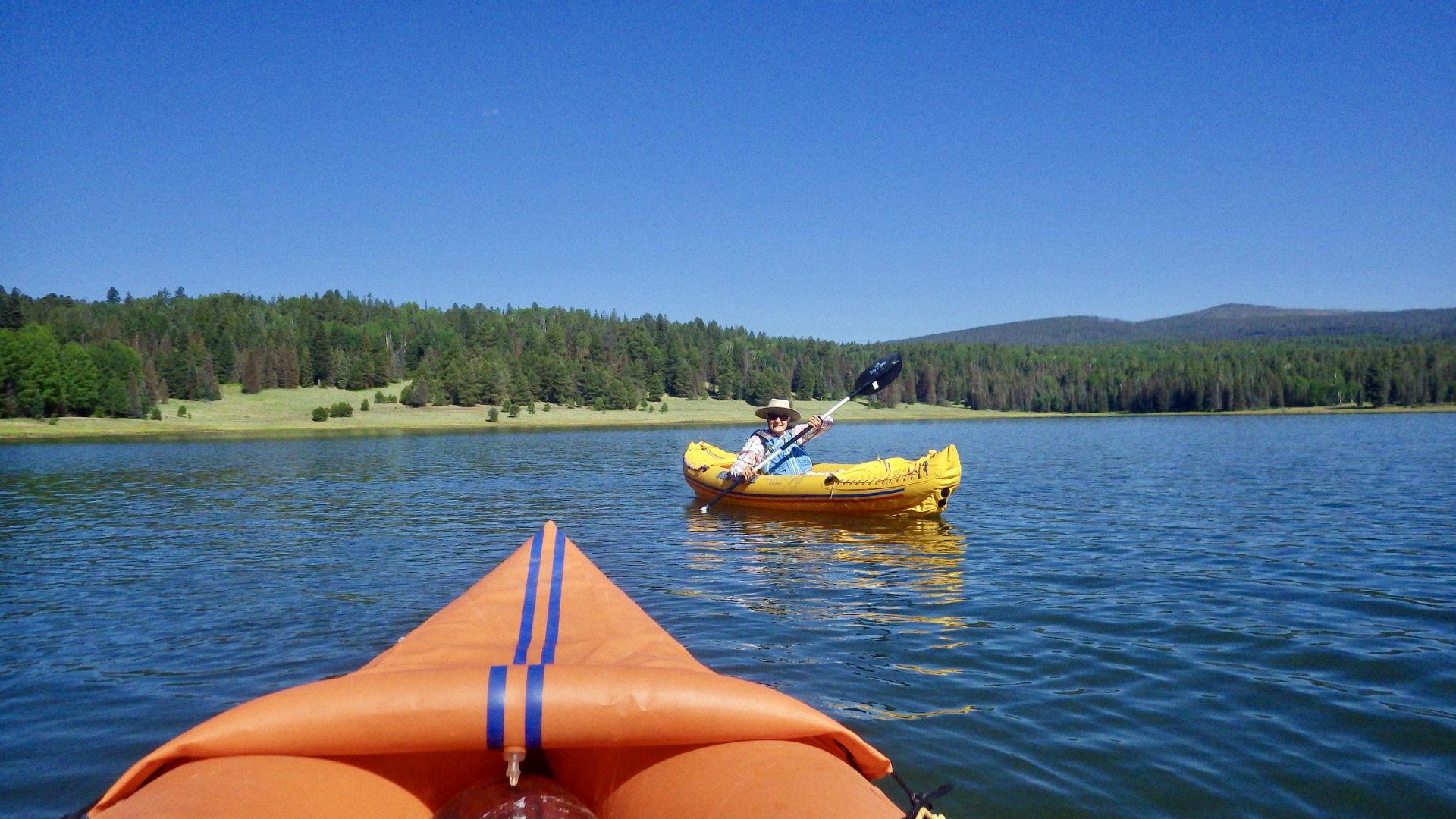 two inflatable kayaks on the lake