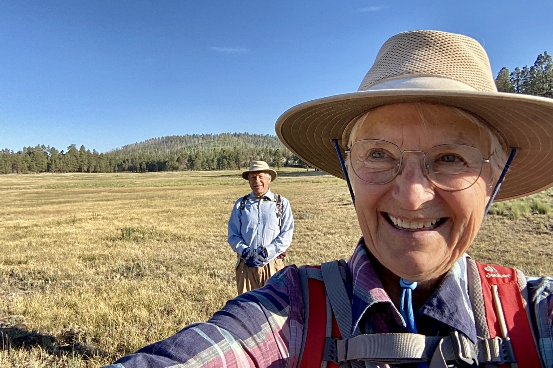 selfie of me and Dennis in an alpine meadow